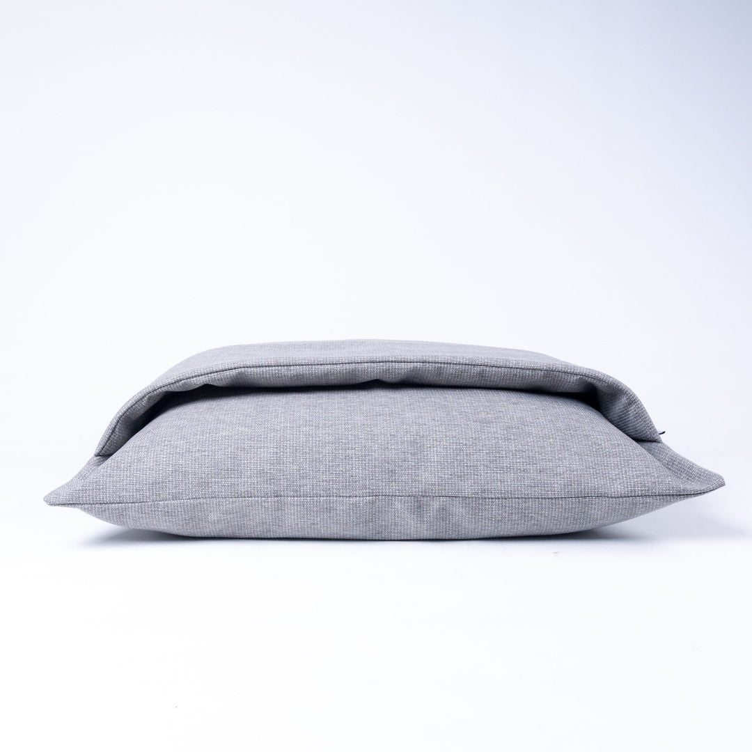 A Dog Snuggle Bed made specifically for dogs that scratch at their beds as part of their nesting ritual. The top of the bed has an insualted duvet cover to keep your dog calm, cosy and content.